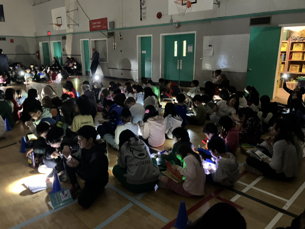 Literacy Week – Reading in the Dark | Clinton Elementary